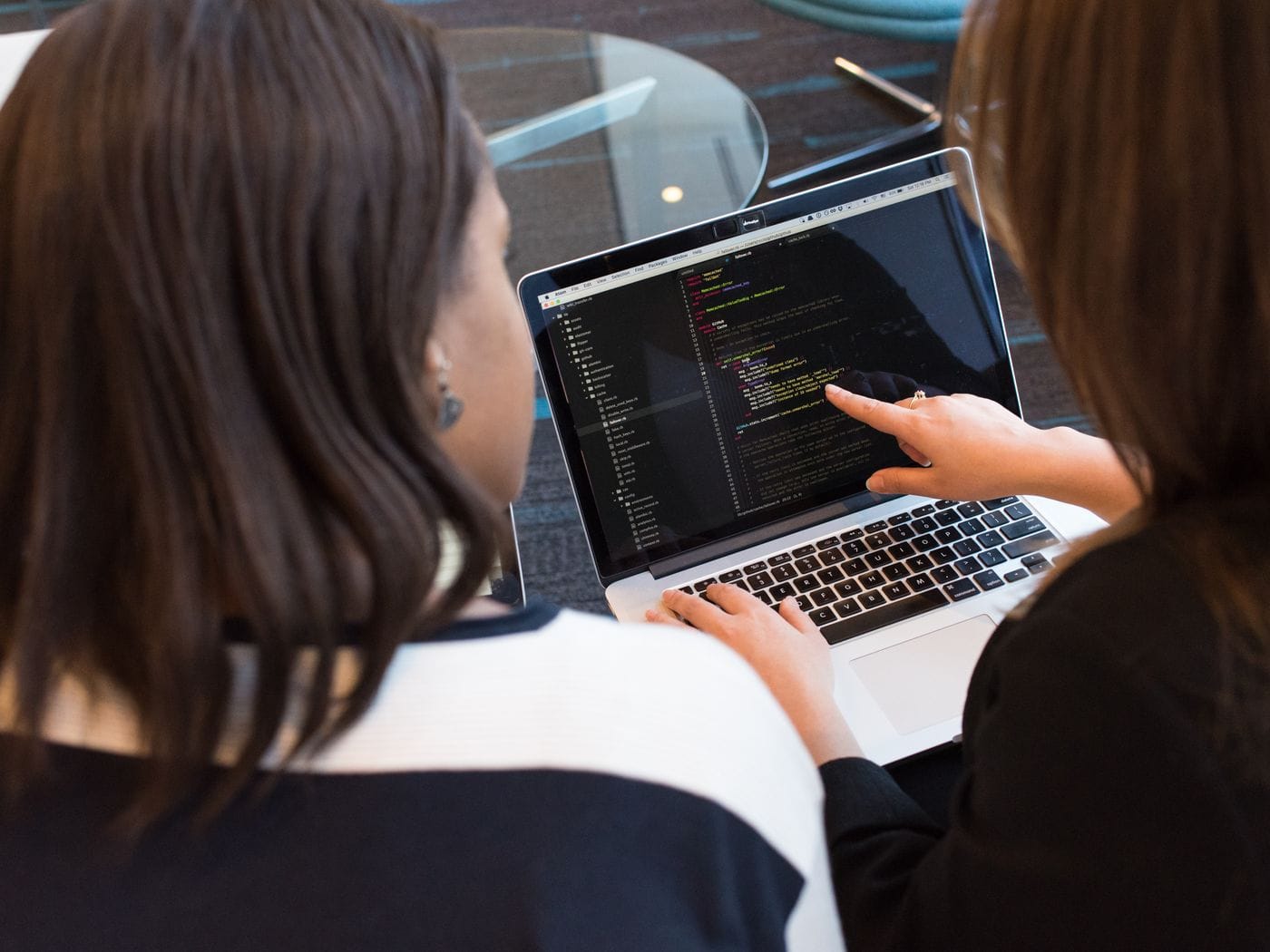 Web developer designing an accessible medical practice website interface on desktop screen